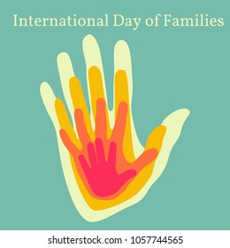 International Day of Families. Concept of a family of 4 people - father, mother, daughter, baby - handprints on each other