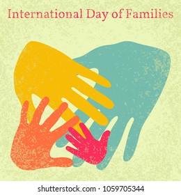 International Day of Families. Concept of a family of 4 people - father, mother, daughter, baby - handprints. Grunge effect.