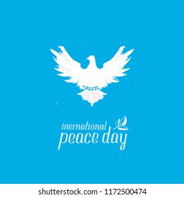 International Day of Peace. Silhouette of a pigeon with an olive branch. Peace Day - September 21. Vector poster or greeting card.