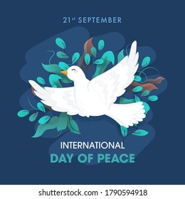 International Day Of Peace Text With Dove Flying And Olive Leaves Decorated On Blue Background For 21st September.