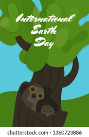 International Earth Day banner illustration of green papercut tree on which owls sit . Layered paper cut out for planet conservation. - Vector