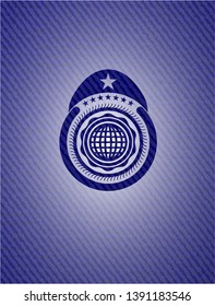 international icon inside badge with denim background