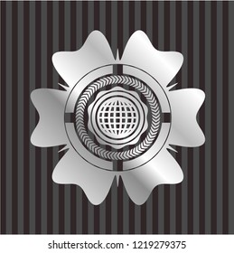 international icon inside silvery emblem or badge