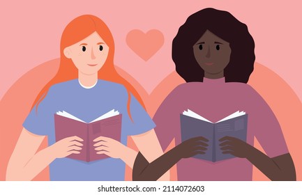 An international lesbian couple reads books in an embrace. Book club. A joint hobby and recreation for lovers