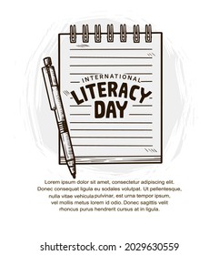 international literacy day with pen and notebook isolated on white background