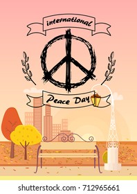 International Peace Day logo. Vector illustration with hippie symbol surrounded by spikelets on foreground of autumn city with golden yellow trees