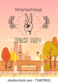 International Peace Day logotype. Vector illustration of peaceful hand showing two fingers surrounded by twigs on background of autumn city