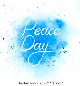 International Peace Day poster. Inscription brush Day of Peace on watercolor background