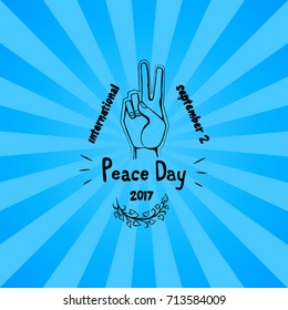 International peace day poster on 2 September 2017 vector. Hand nonverbal sign with two fingers meaning freedom isolated on blue background with rays