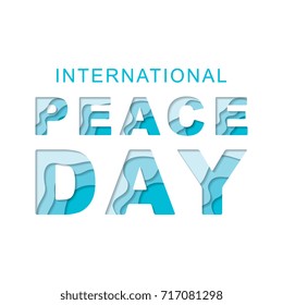 international peace day text with paper cut layers 3d effect on a white background