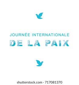 international peace day text with paper cut layers 3d effect on a white background