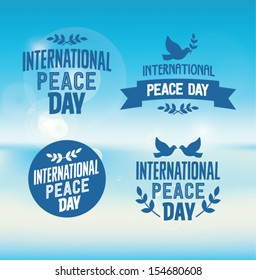 International Peace Day Typographic Designs with Pigeons and Olive Branches