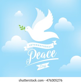 International peace day typography. Greeting card for 21 september. Peace day background. Dove with branch in the sky.