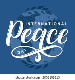 International Peace Day vector concept. Modern brush calligraphy Peace Day decorated by planet earth silhouette and tree branches.