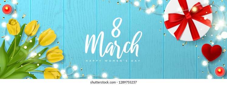 International Women's Day horizontal banner. Vector illustration with realistic yellow tulips flowers, gift box, ring box, candles, glowing garland and golden confetti. Greeting card for 8 March.