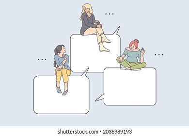 Internet communication and chatting concept. Young smiling girls friends sitting on speech bubbles greeting each other online from smartphone screen online vector illustration 