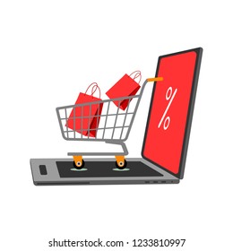 Internet discount concept with open laptop and trolley with red bags on white background.