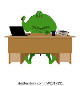 Internet troll. Big green goblin sits at laptop. Org and computer. Green Monster writes comments