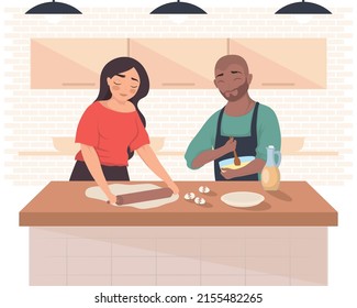 interracial couple cooking in the kitchen