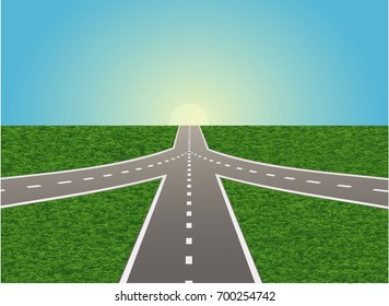 Intersection on a highway, green grass and blue sky
