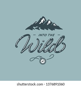 Into the wild. Lettering inspiring typography poster with mountains. Vector illustration.
