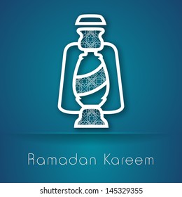 Intricate arabic lantern on abstract blue  background for holy month of muslim community Ramadan Kareem.