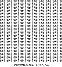 Intricate black and white geometric pattern with repeating floral motifs and dots
