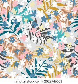 Intricate botanical seamless pattern. Hand drawn meadow daisies, and exotic leaves. Colorful floral background made of small flowers  and tropical twigs for fashion, textile and fabric.