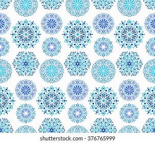 Intricate Indigo Round Pattern. Traditional Persian seamless pattern. Round ornaments from blue mandalas with floral elements. Blue white flower design. Hippie, boho chic. Vector fashionable fabric.