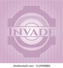 Invade badge with pink background