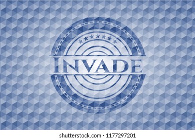 Invade blue emblem with geometric pattern background.