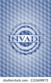 Invade blue hexagon badge.