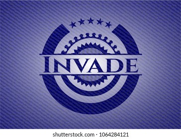 Invade emblem with jean background