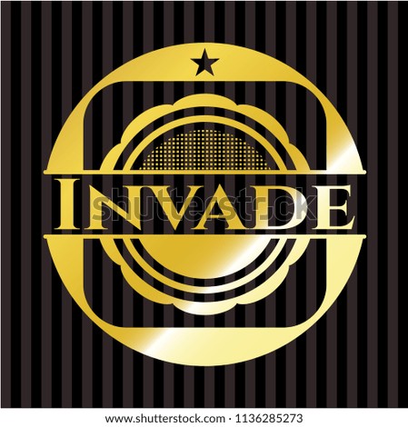 Invade gold badge or emblem