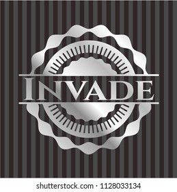 Invade silvery emblem