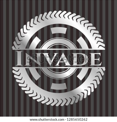 Invade silvery emblem