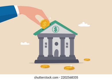 Investment bank financial service to provide invest advisory, wealth management or loan for company, money growth or profit and earning concept, businessman hand put dollar coin on investment bank.