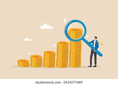 Investment or financial analysis, wealth management or revenue growth, economic or profit improvement, income or portfolio analysis concept, businessman with magnifying glass on growth coin stack.