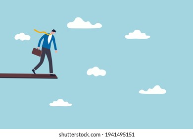 Investment or financial risk to fall down from economic recession, fear of losing money or debt payback concept, businessman standing on high jumping wood in the sky looking down with fear of height.