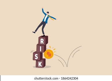 Investment risk, volatility and fluctuation in stock market that price will drop, stability and uncertainty concept, businessman investor falling from stack block with word RISK impact by money coin.