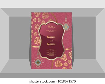 Invitation card wedding gold pattern on a pink background.