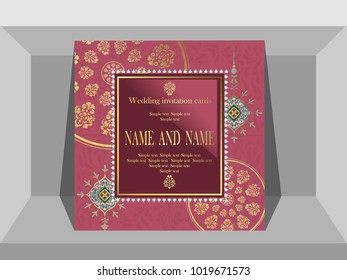 Invitation card wedding gold pattern on a pink background.