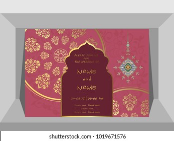 Invitation card wedding gold pattern on a pink background.