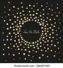 Invitation wedding card with metal heart confetti on a black background and words "Save the date" 