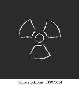 Ionizing radiation sign hand drawn in chalk on a blackboard vector white icon isolated on a black background.