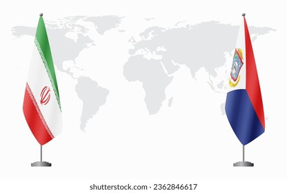 Iran and Sint Maarten flags for official meeting against background of world map.
