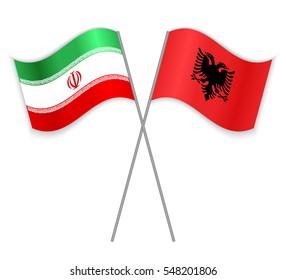 Iranian and Albanian crossed flags. Iran combined with Albania isolated on white. Language learning, international business or travel concept.