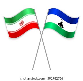 Iranian and Basotho crossed flags. Iran combined with Lesotho isolated on white. Language learning, international business or travel concept.