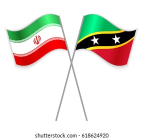 Iranian and Kittitian crossed flags. Iran combined with Saint Kitts and Nevis isolated on white. Language learning, international business or travel concept.