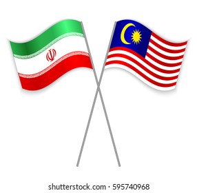 Iranian and Malaysian crossed flags. Iran combined with Malaysia isolated on white. Language learning, international business or travel concept.